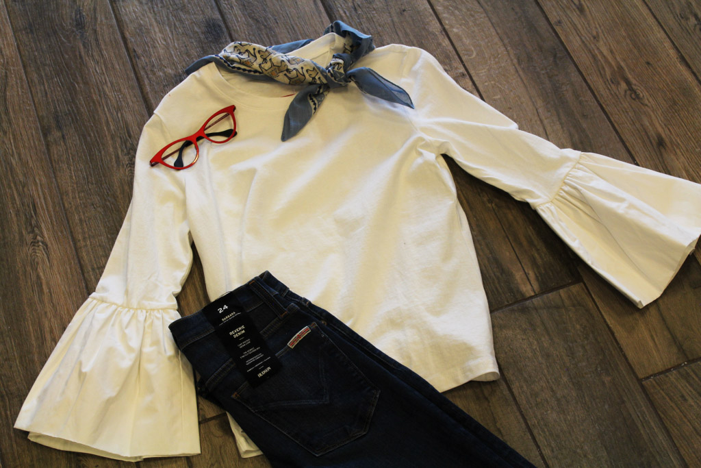 White shirt with black jeans and red frames